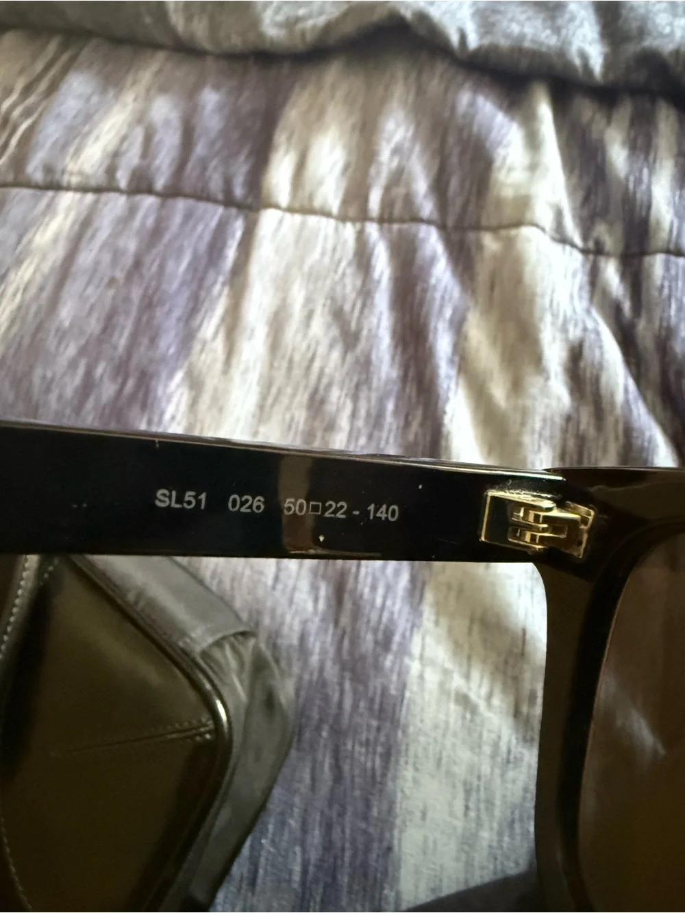 Saint Laurent Black Frame Sunglasses with Purple Mirrored Lenses